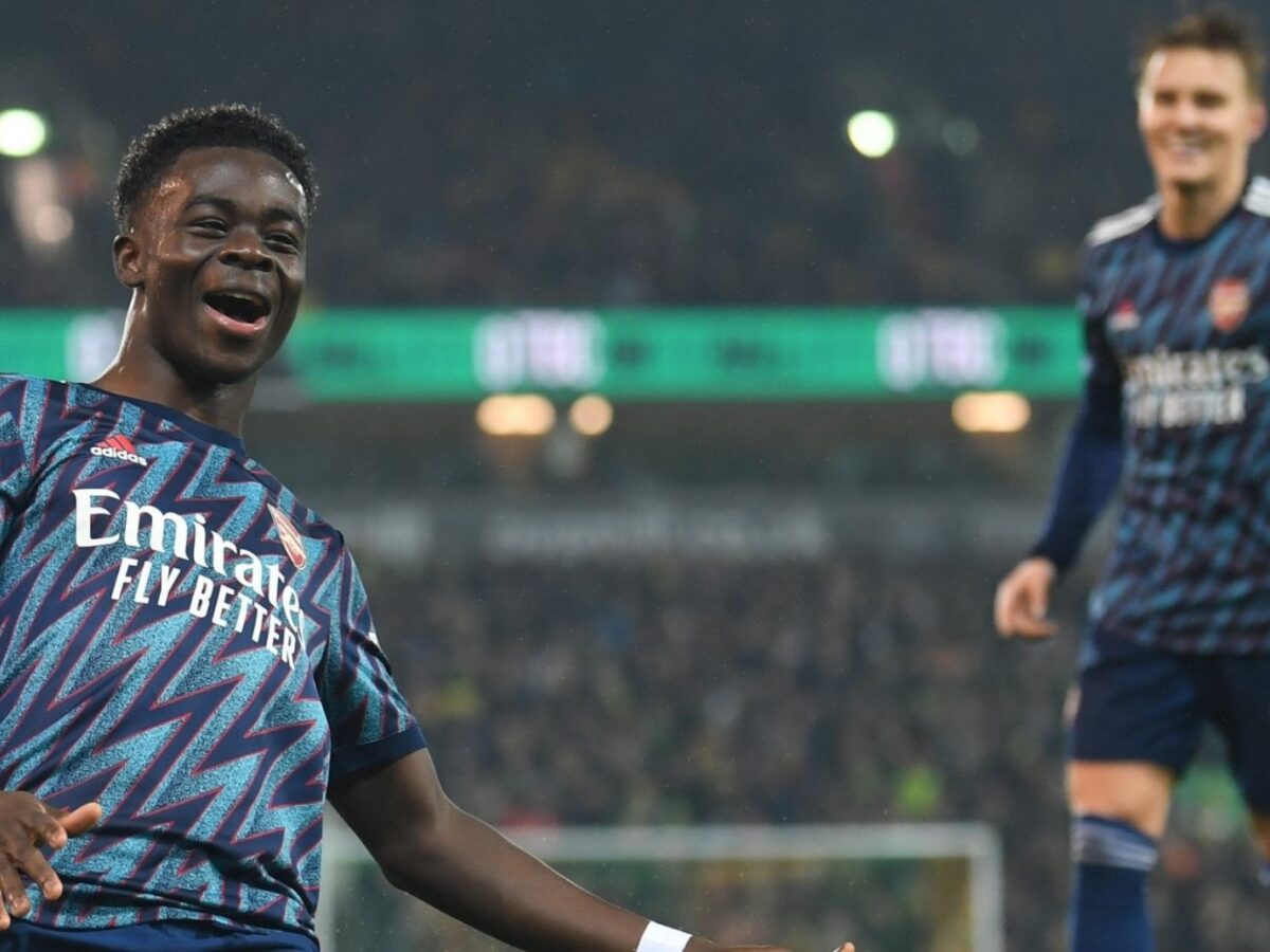 Bukayo Saka and Martin Odegaard celebrating a goal against Norwich