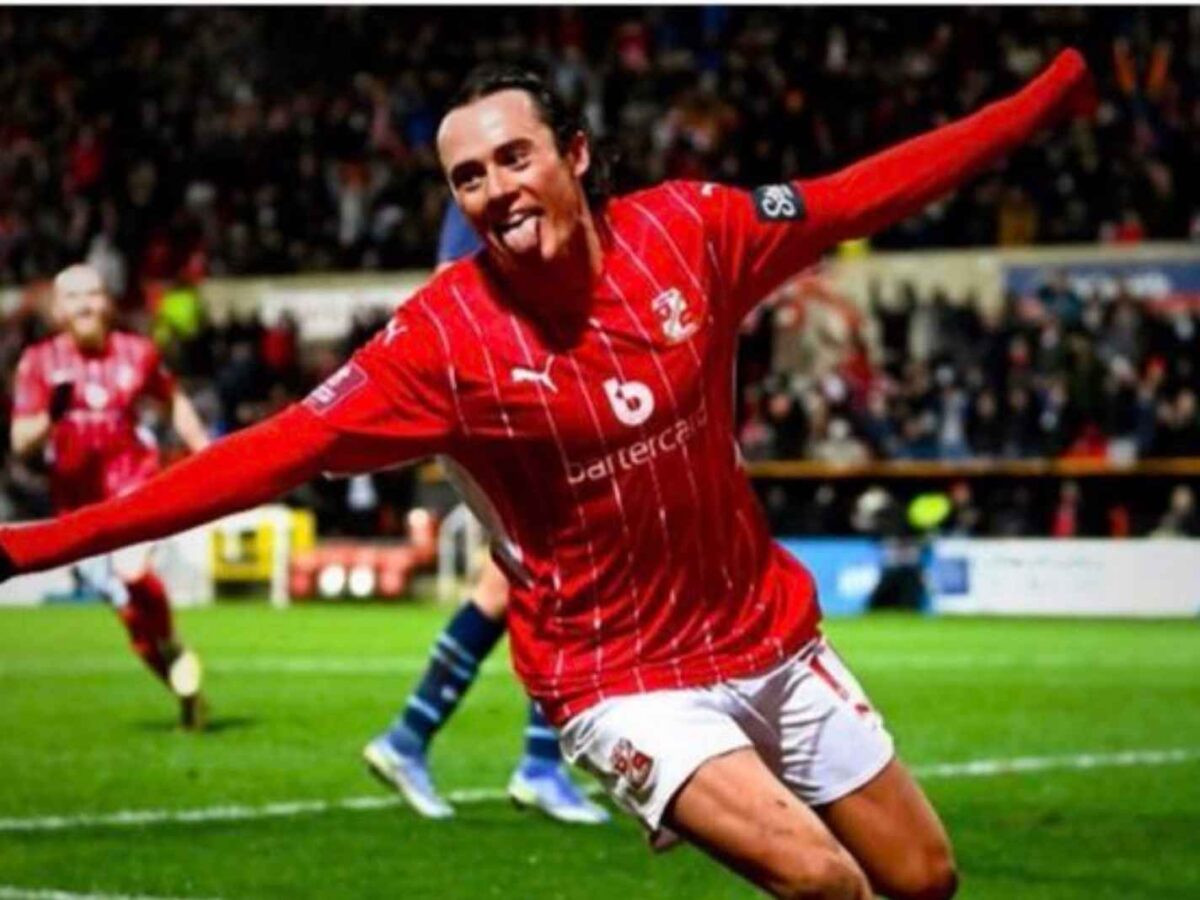 Harry McKirdy celebrates after scoring a goal against Man City