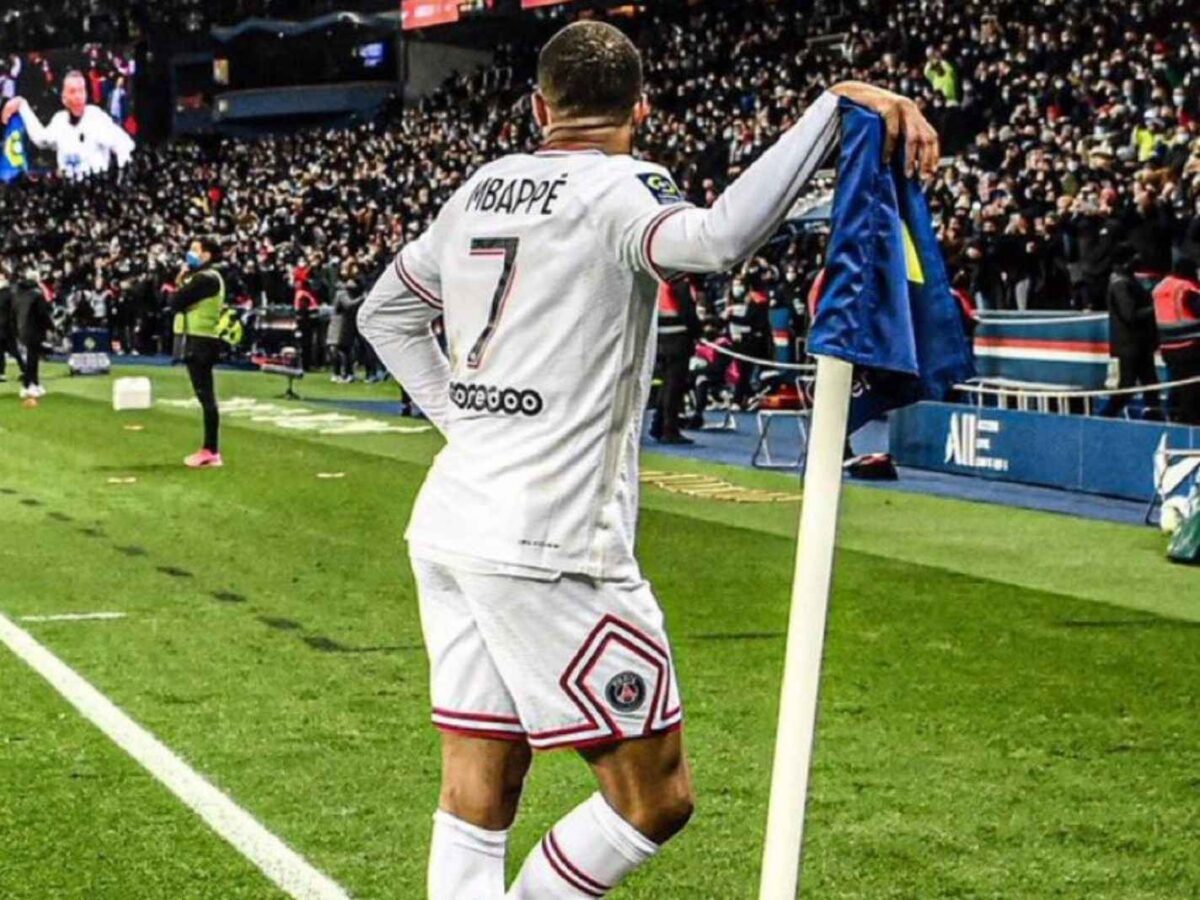 Kylian Mbappe celebrates with corner flag