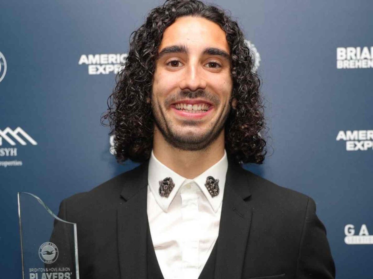 The image shows Marc Cucurella holding his Brighton POTY award.